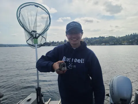 Hannah Pennebaker holding a kokanee.