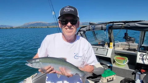 Man holding fish.