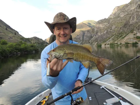 Man holding smallmouth bass.