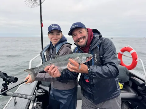 Holding coho salmon.